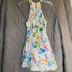 Express midi dress with a halter like top. White with floral accents.
